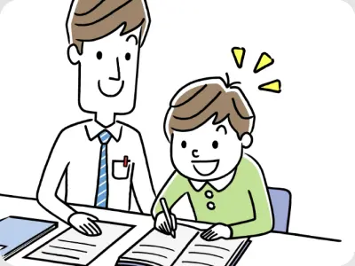 先生と一緒に笑顔で勉強する子ども